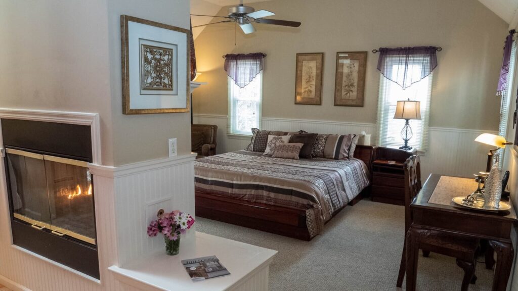 The Pattison Deluxe Room King Bed and Double Sided Fireplace